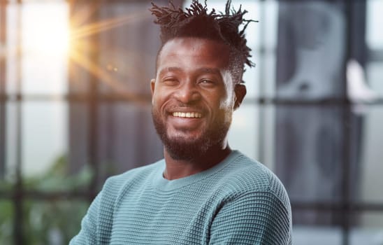 Confident black business man looking at camera with serious expression