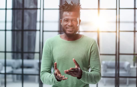 Portrait of a happy African American entrepreneur in office
