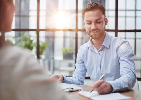 Handsome bearded man in a modern office