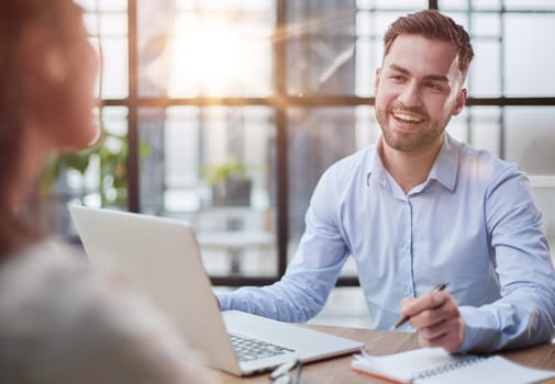 Handsome bearded man in a modern office