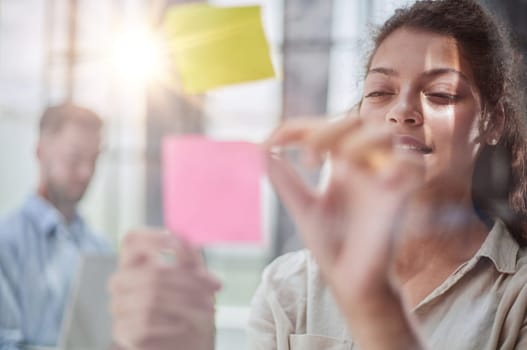 Bringing her vision to life. Shot of a confident businesswoman presenting an idea to her colleague