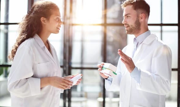 doctors read the dosage of the drug while standing in the lobby of the hospital
