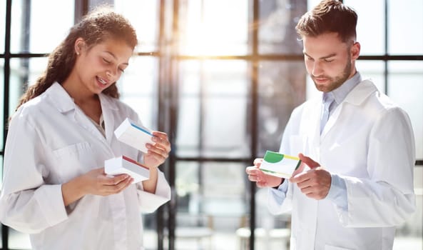 doctors read the dosage of the drug while standing in the lobby of the hospital