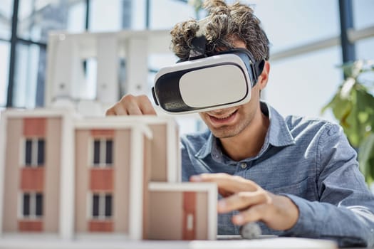 looks at the layout of the apartment in virtual reality glasses.