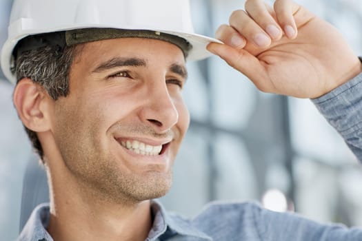 portrait of a confident businessman in a protective helmet