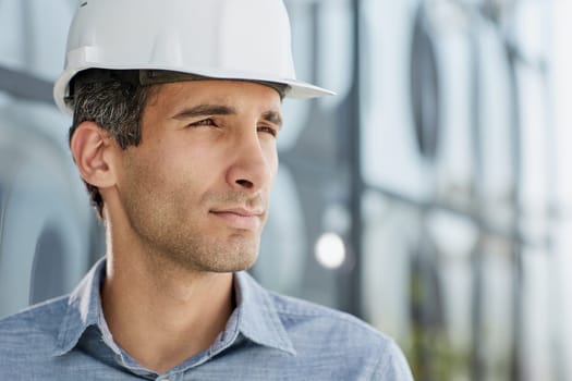 portrait of a confident businessman in a protective helmet