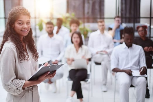 Business people attending a seminar with social distancing