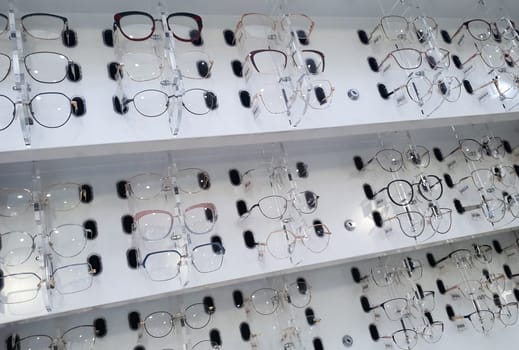 A showcase from an optics store, a variety of eyeglass frames. High quality photo