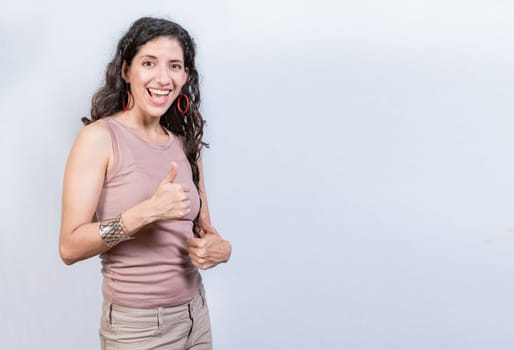 Happy smiling woman with thumbs up doing ok. Happy girl with thumbs up on isolated background, Smiling woman showing ok gesture isolated
