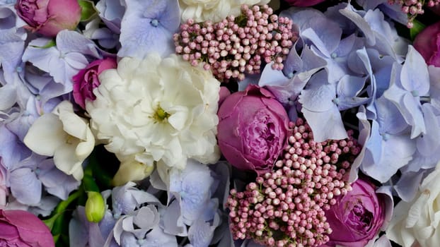 Floral natural background with blue gardenia, pink rose, white chrysanthemum close-up