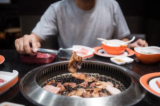 beef and pork slice on grille for barbecue or Japanese style yakiniku