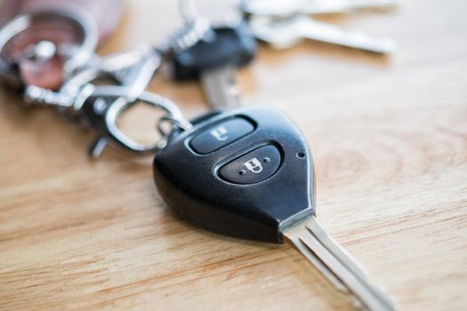 Close up of car key on wood table