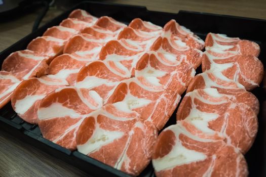 Raw beef slice for barbecue or Japanese style yakiniku