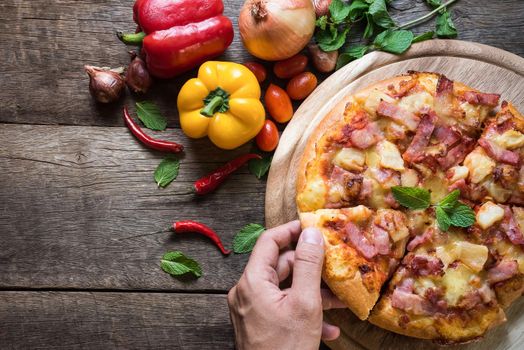 Delicious italian pizza on wooden table. Top view