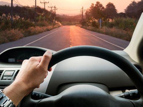 man driving car on the road