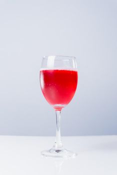 isolated glass with red wine on white background