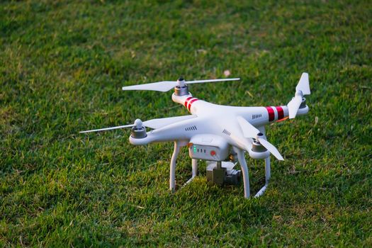 Drone landing on green grass
