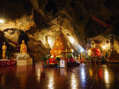 CHIANG RAI, THAILAND - JULY 29 2017: Interior of Tham pha jom golden temple in the cave on July 29, 2017 in Chiang rai, Thailand.