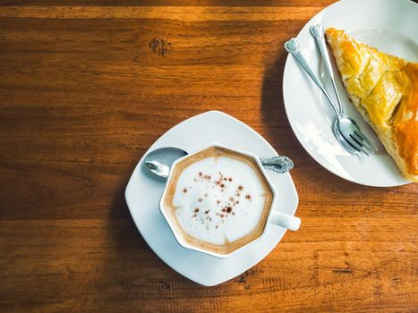 coffee with chicken pie on wood table