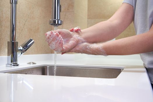Woman washing hands with antibacterial soap for corona virus prevention, hygiene to stop spreading coronavirus covid19