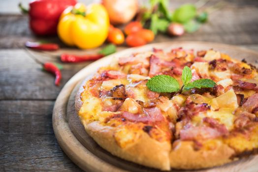 Delicious italian pizza on wooden table