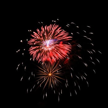 Colorful fireworks isolated on black sky background.