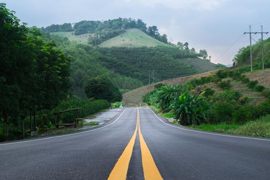 Empty road with sky and sunlight