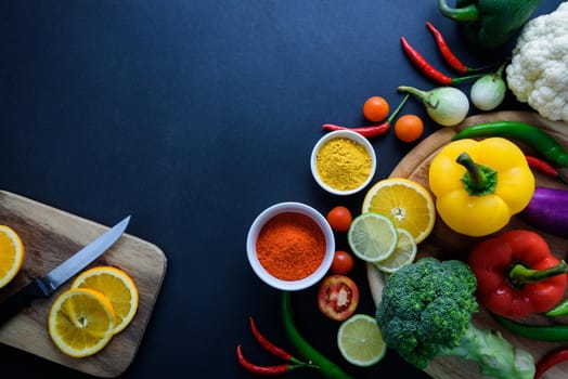 Healthy food concept of fresh organic vegetables and wooden desk background. Ingredients top view