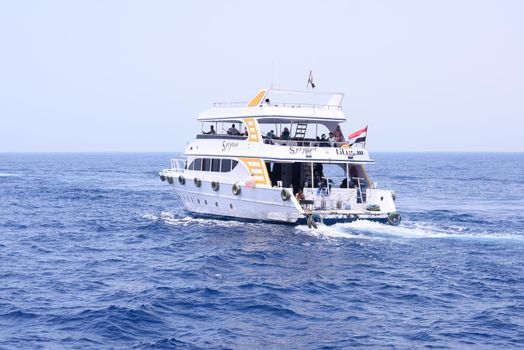 a beautiful two-deck yacht carries people on the sea. tourist boat trip. Editorial. Egypt, Sharm el-Sheikh, Red Sea - August 05. 2021