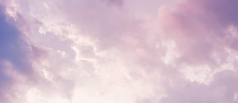 Background of a beautiful pink and pale purple sky with clouds at sunset. High quality photo