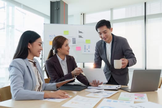 Business People Meeting to analysis the financial report paperwork in office. Financial advisor teamwork and accounting concept.