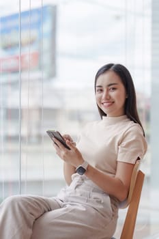 Beautiful Businesswoman completes KYC using an online banking program in order to open a digital savings account. The definition of cyber security.