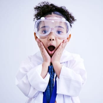 Child, shocked and science portrait with glasses in studio with open mouth, wow or surprised face. African kid student excited for education or biology experiment and learning for future scientist.