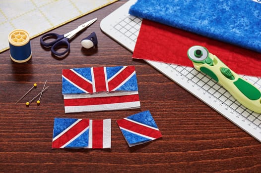 Parts of future pincushion viewing like union jack flag, sewing accessories