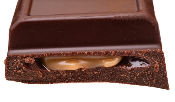 Chocolate bar with caramel isolated on white background close-up