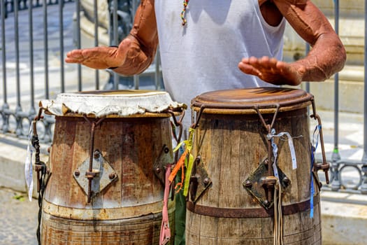 Drum player with his atabaque in the streets of the historic district of Pelourinho in Salvador in Bahia