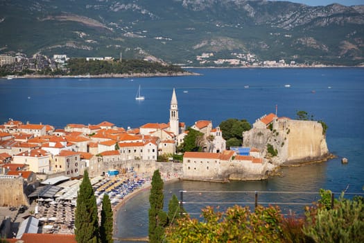 Montenegro - Budva: July 4, 2021.: Aerial view of the old town of Budva, the Adriatic sea and mountains