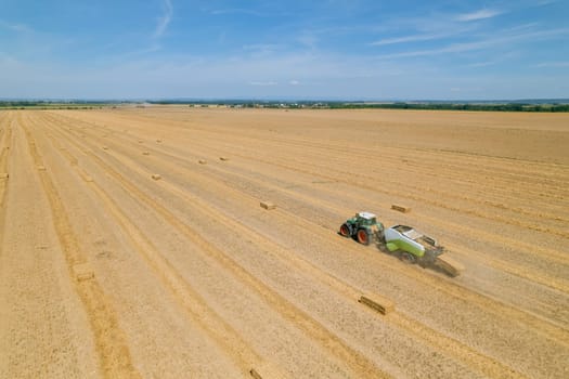 Tractors are used to collect and transport the straw from the field.