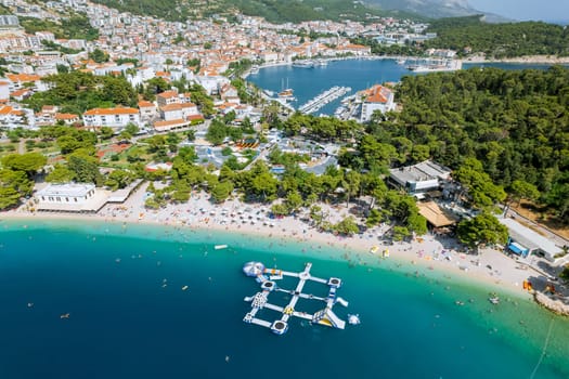 View from top of the sea, and fun on beach on inflatable mattresses and circles.