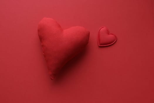 Valentine's Day background. Red heart on a red background.