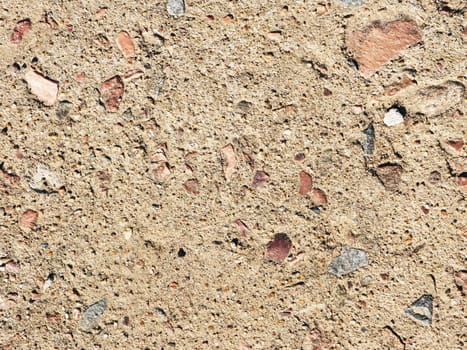 Light brown concrete wall with a rough texture. Texture for design with copy space. cement wall background.