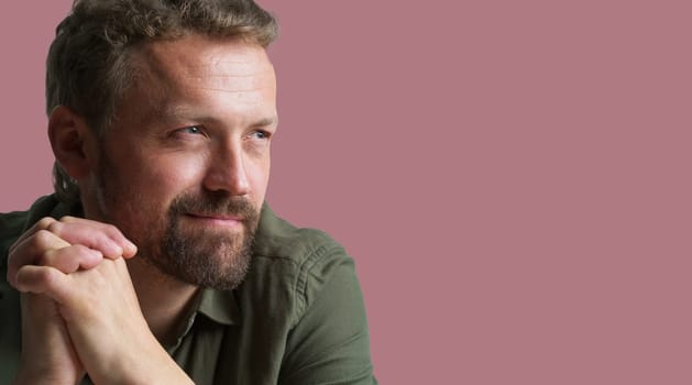 Portrait of man isolated on pink background. Ideal image to accompany articles or content related to men's lifestyle, habits, interests. Masculinity, showcasing man's fashion, style, and grooming choices. . High quality photo