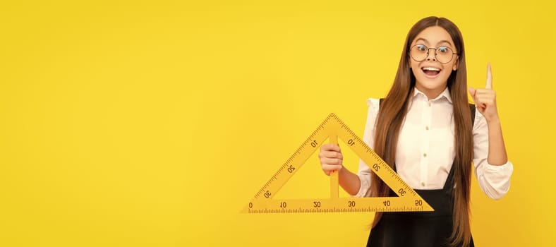 inspired with idea teen girl hold triangle. back to school. algebra and geometry. Portrait of schoolgirl student, studio banner header. School child face, copyspace