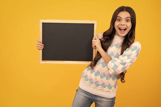 Little girl teen with blackboards. Teenager school girl hold blackboard for copy space, school sale