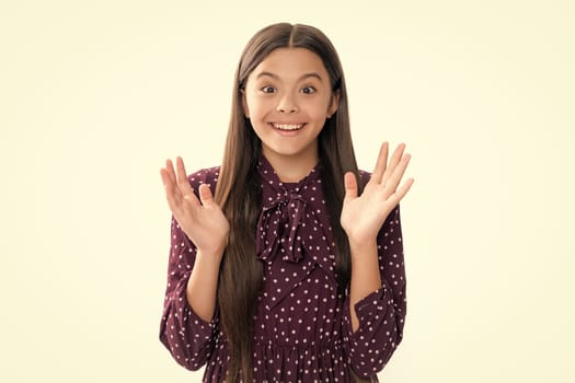 Portrait of happy smiling teenage child girl. Amazed child with open mouth on white background, surprise