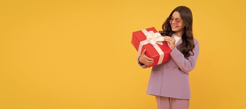 boxing day. happy kid with present box. teen girl giving birthday gift. Kid girl with gift, horizontal poster. Banner header with copy space