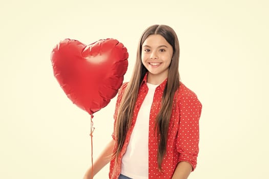 Teenage girl hold shape heart, heart-shape sign. Child holding a red heart love holiday valentine symbol, isolated on white background. Portrait of happy smiling teenage child girl