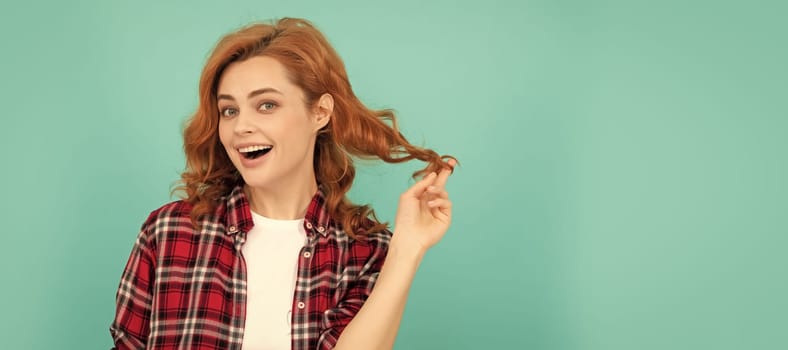 happy redhead woman with curly hair in checkered casual shirt, style. Woman isolated face portrait, banner with mock up copyspace