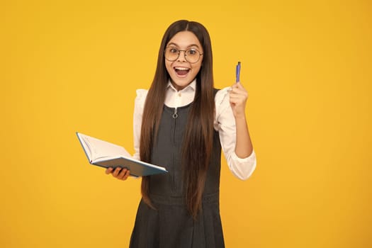Teenager school girl with books isolated studio background. Surprised face, surprise emotions of teenager girl
