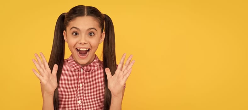 Pleasantly surprised happy kid keep mouth open yellow background, surprise. Child face, horizontal poster, teenager girl isolated portrait, banner with copy space